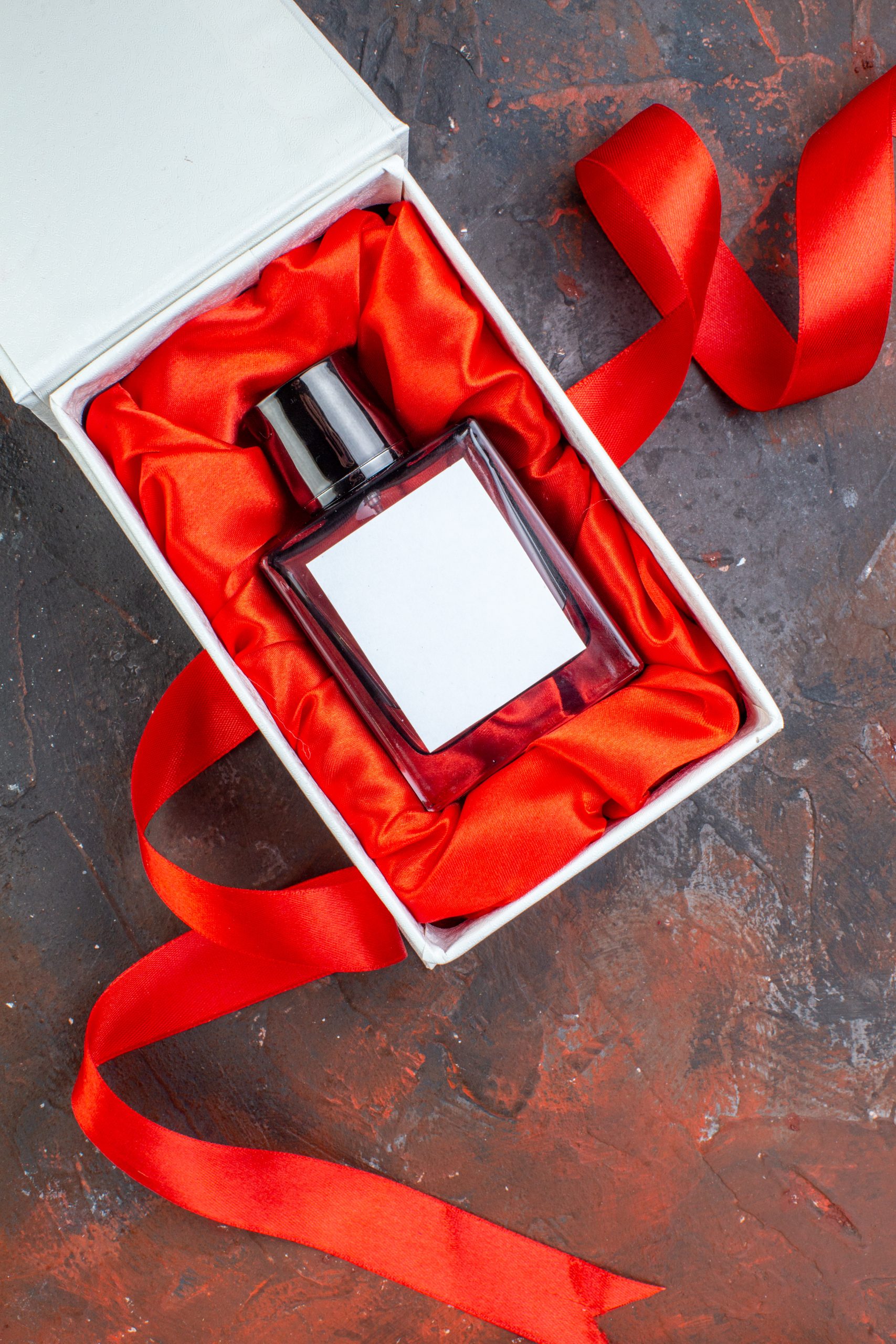top-view-valentines-day-present-fragnance-dark-surface-gift-perfume-love-feeling-color-lover-couple-happiness-woman